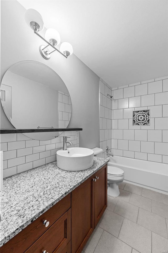 full bathroom featuring backsplash, vanity, toilet, and bathtub / shower combination