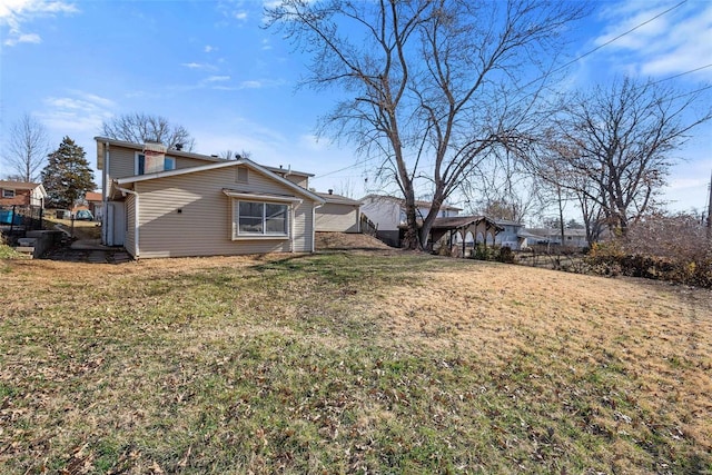 view of property exterior with a yard