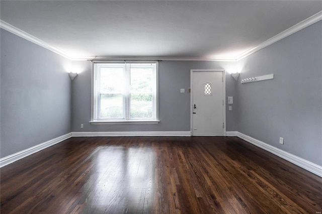 entryway with baseboards, dark wood finished floors, and crown molding