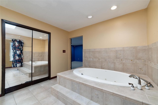 full bathroom with tile patterned floors, baseboards, a tub with jets, and recessed lighting