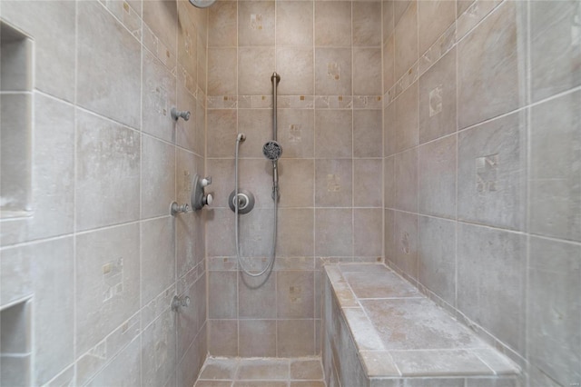 bathroom with tiled shower