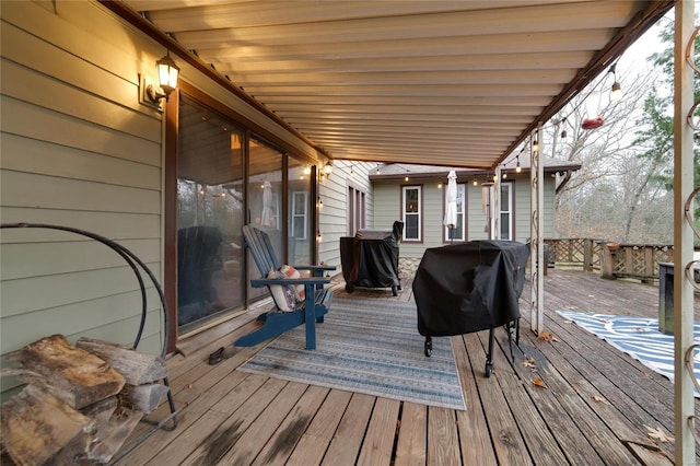 wooden deck featuring grilling area