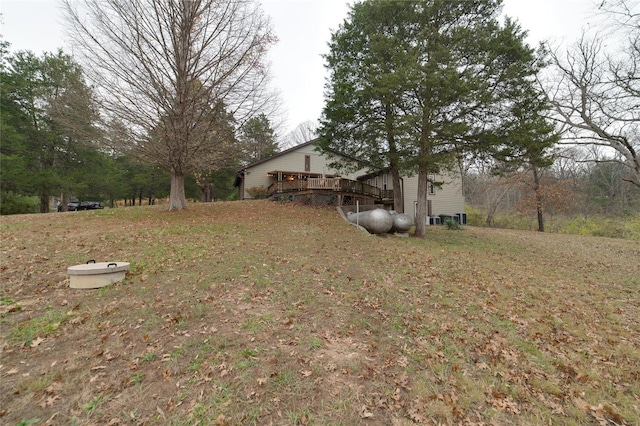 view of yard featuring a wooden deck