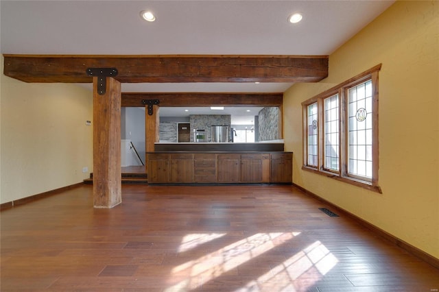 kitchen with recessed lighting, visible vents, baseboards, and wood finished floors