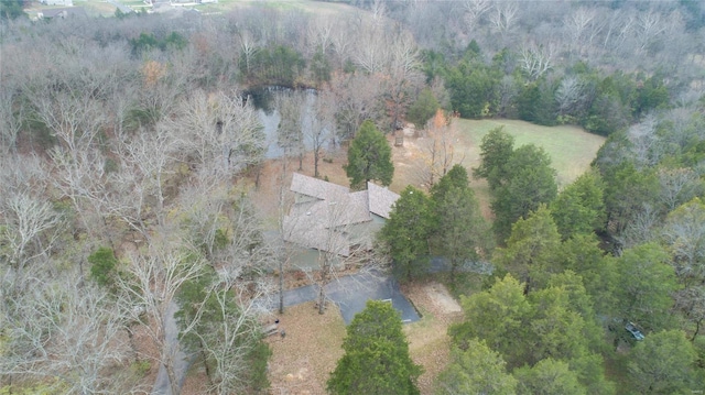 birds eye view of property with a forest view