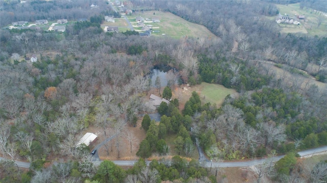 drone / aerial view featuring a view of trees