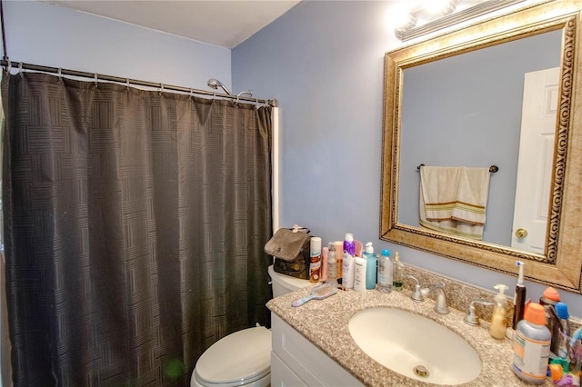 full bathroom with vanity, a shower with shower curtain, and toilet