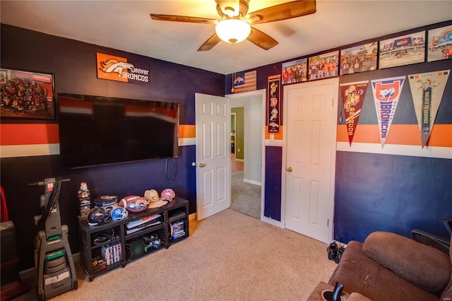 playroom featuring carpet and a ceiling fan