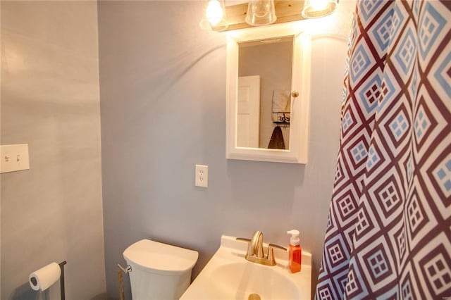 bathroom featuring a sink and toilet