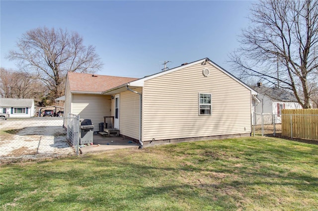 view of side of home with a patio area, fence, a lawn, and crawl space