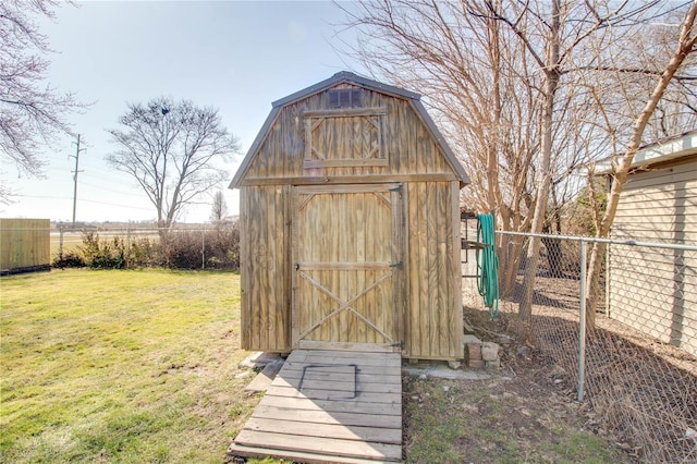 view of shed with fence