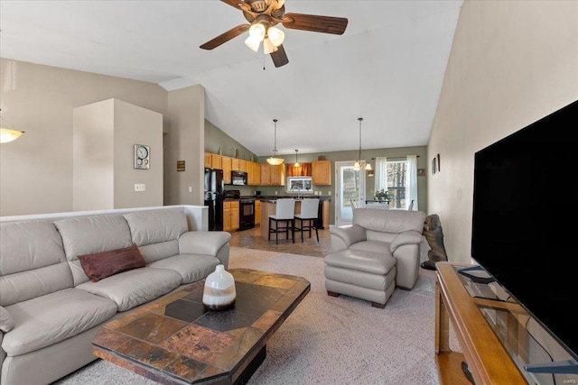 living room with high vaulted ceiling and ceiling fan