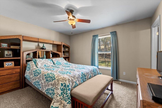 bedroom with carpet flooring, baseboards, and ceiling fan