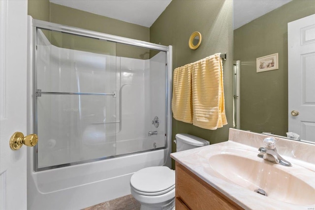 full bath with vanity, toilet, and combined bath / shower with glass door