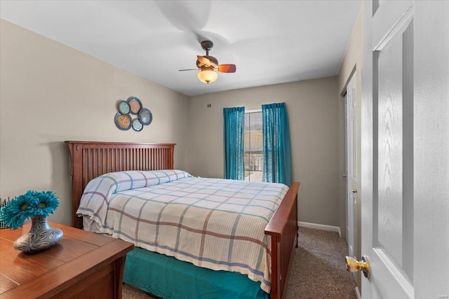 bedroom featuring baseboards, a ceiling fan, and carpet flooring