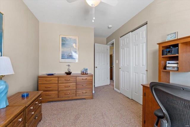 office with light carpet and a ceiling fan