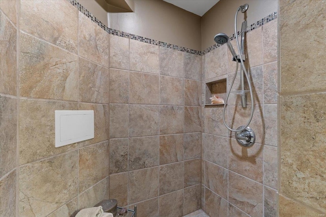 bathroom with a tile shower