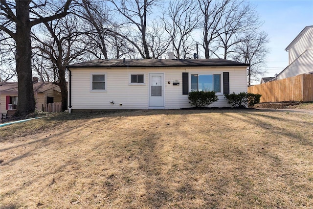 single story home featuring a front yard and fence