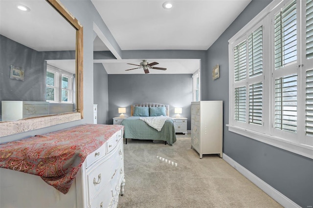 bedroom featuring recessed lighting, light colored carpet, a ceiling fan, and baseboards