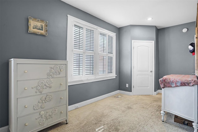 bedroom featuring visible vents, baseboards, and carpet