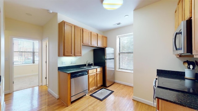 kitchen featuring a wealth of natural light, visible vents, appliances with stainless steel finishes, and light wood finished floors