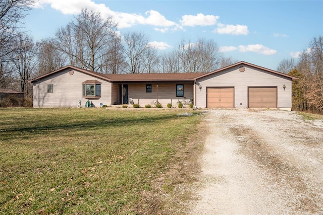 single story home featuring an attached garage, a front yard, and dirt driveway