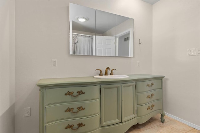 full bathroom with tile patterned flooring, visible vents, vanity, and baseboards