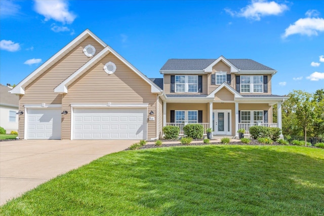 view of front of home featuring a porch, driveway, a front yard, and a garage