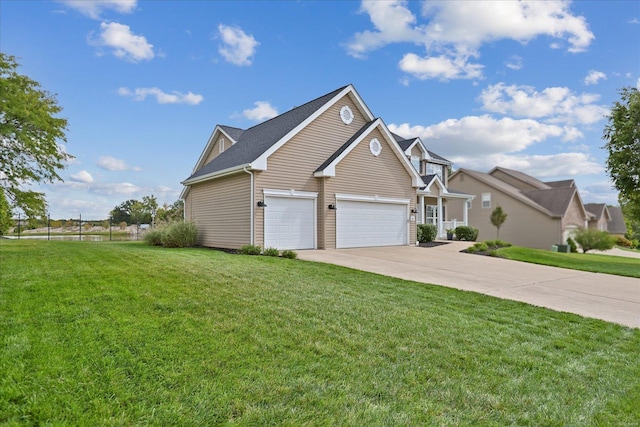 view of side of home with driveway and a yard