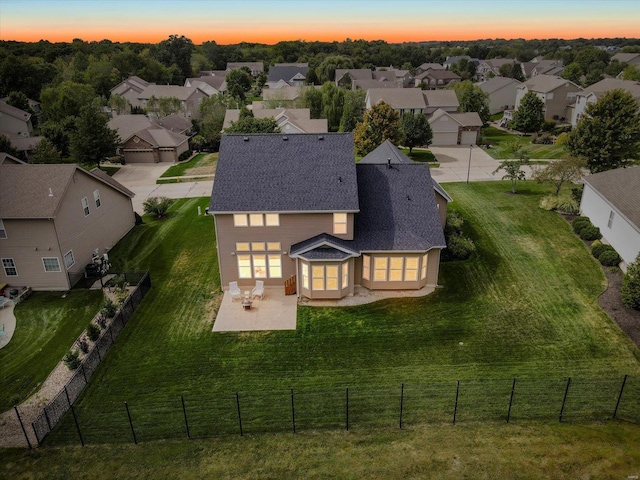 aerial view at dusk with a residential view