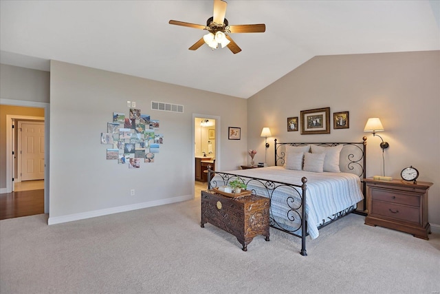 bedroom with a ceiling fan, visible vents, baseboards, lofted ceiling, and light colored carpet