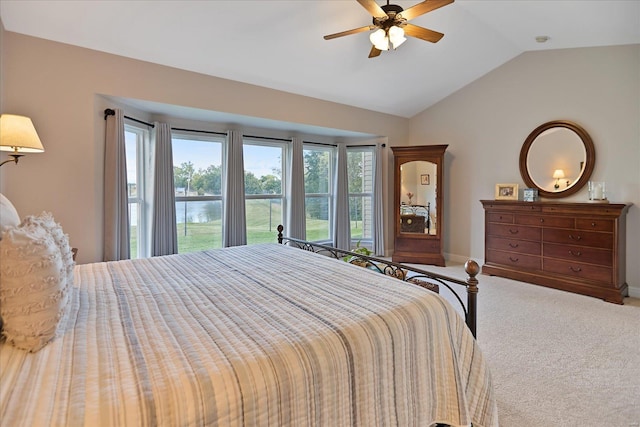 bedroom with baseboards, carpet floors, a ceiling fan, and vaulted ceiling