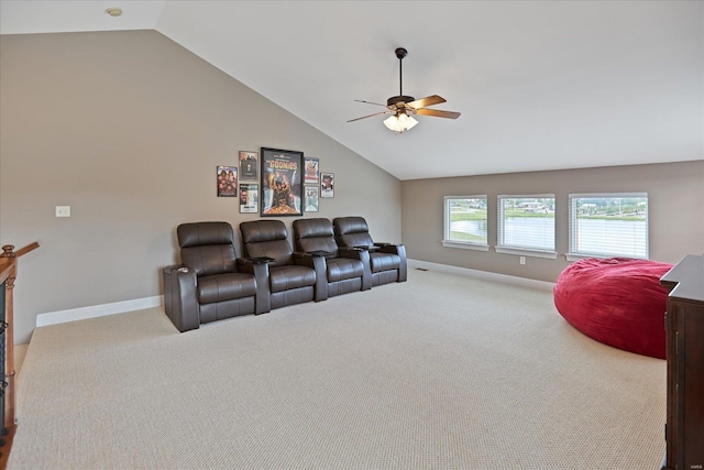 cinema with baseboards, ceiling fan, carpet flooring, and vaulted ceiling