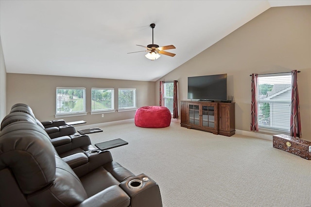 carpeted living room featuring high vaulted ceiling, baseboards, and a ceiling fan