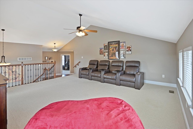 living area featuring lofted ceiling, carpet, visible vents, and baseboards