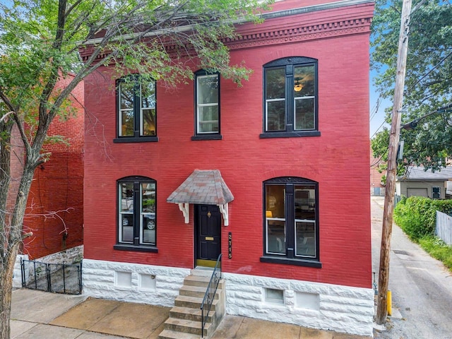 view of front of house with brick siding