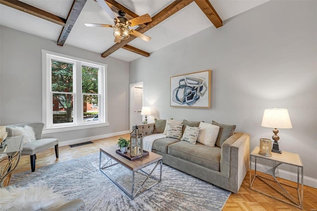 living area with beam ceiling, baseboards, visible vents, and ceiling fan