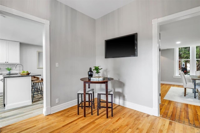 interior space with light wood-style flooring and baseboards