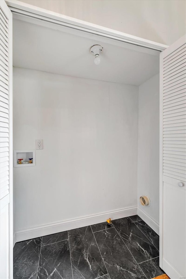 laundry area with washer hookup, laundry area, baseboards, and marble finish floor