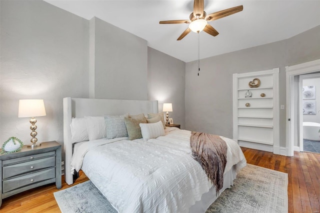 bedroom featuring ceiling fan and hardwood / wood-style flooring