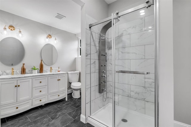 full bath featuring visible vents, toilet, a stall shower, a sink, and double vanity