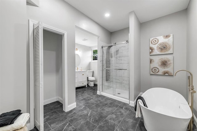 bathroom with baseboards, a freestanding bath, a stall shower, marble finish floor, and vanity