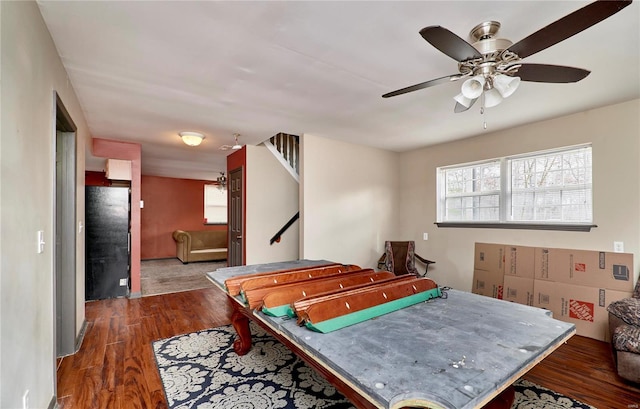 game room with wood finished floors and a ceiling fan