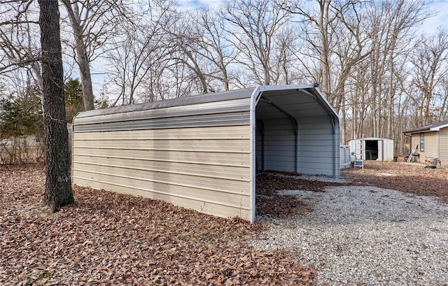 view of outbuilding with a carport