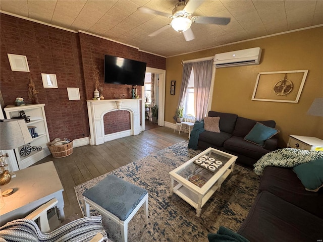 living area with brick wall, hardwood / wood-style flooring, a wall mounted AC, and ornamental molding