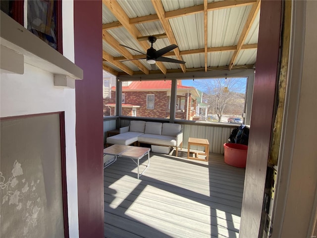 wooden deck featuring an outdoor hangout area and ceiling fan