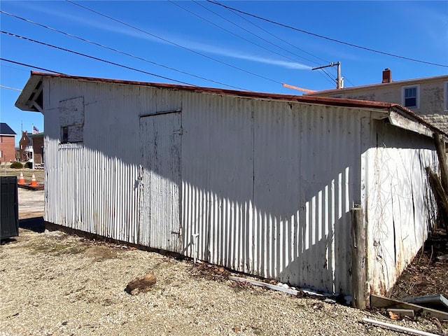 view of home's exterior featuring an outdoor structure