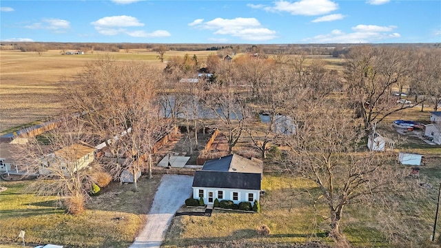 birds eye view of property with a rural view