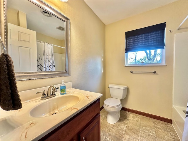 bathroom with curtained shower, toilet, vanity, and visible vents