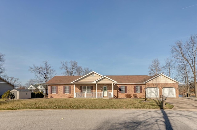 ranch-style house featuring driveway, brick siding, a porch, and a front lawn